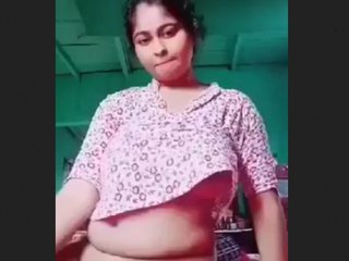 A stunning woman with large breasts engages in a passionate rendezvous