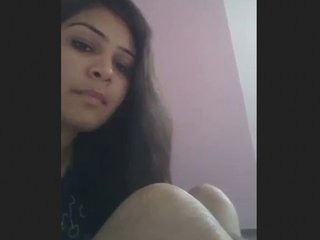 A South Asian woman reveals her small and tight white genitals in an erotic video