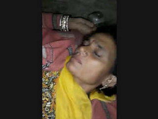 A mature woman from the village enjoys sexual intercourse with a man