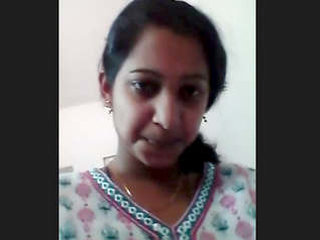 An Indian woman of South Asian descent displays her pubic hair on her moist vagina