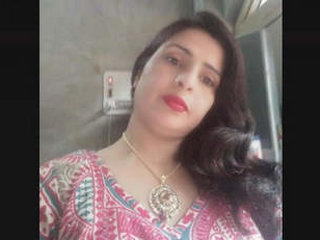 Indian mature woman engages in sexual activity on camera