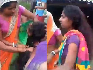 Indian sister in a heated brawl outdoors, revealing her breasts