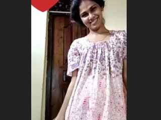 A stunning woman provocatively displays her breasts and intimate parts on film