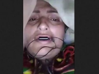 Elderly wife demonstrating, labeled as bhabi