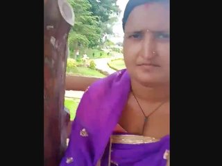 A wife and her partner have fun with outdoor breast fondling at the park