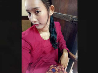 A slender young woman pleasures herself with vegetables