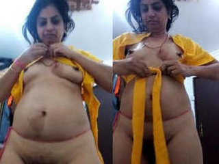 Indian aunt displays her breasts and vagina