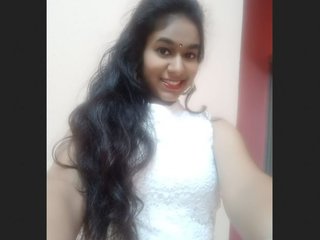 An Indian girlfriend displays her attractive physique for her partner while getting dressed