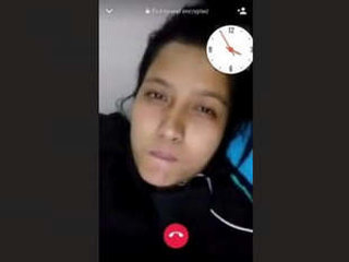 A charming South Asian woman reveals her breasts during a video chat