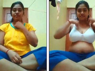 A college girl shares her large breasts in a self-shot video for her boyfriend