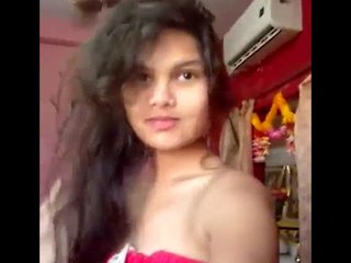 A seductive woman undresses and tantalizes in her private room