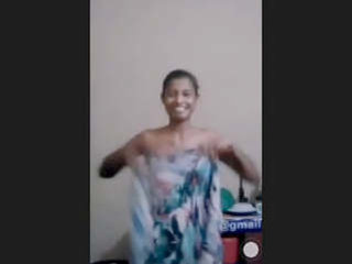 A Sri Lankan woman proudly displays her large breasts