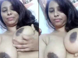 Indian office girl with large breasts puts on a show