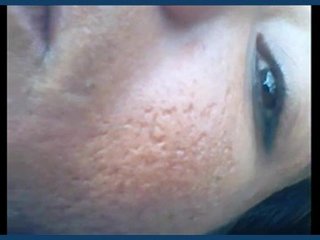 Mature Indian woman engages in outdoor intimate encounter in blue field