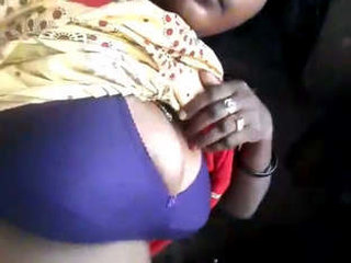 A village girl revealing her breasts and intimate parts