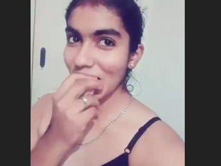 A seductive African-American woman exhibiting her charms, labeled as a bhabi.