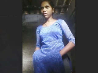 A young woman from a rural area takes a bath and films herself