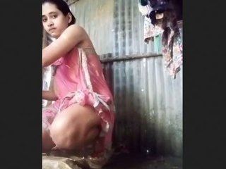Indian wife's open-air bath in the countryside