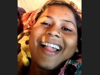 Waafiyah, an Indian woman with large breasts, displays them in a rural setting