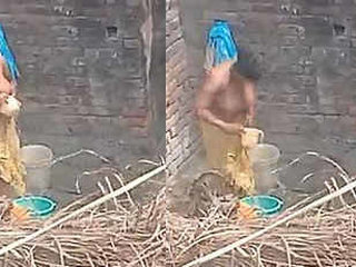 Indian aunt takes outdoor bath