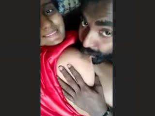A girl from India fondly stimulates her breasts and vagina
