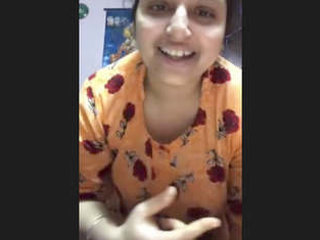 Indian housewife tantalizes with her ample bosom