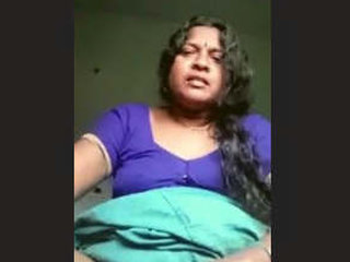 Aroused Tamil housewife displays her breasts and intimate area