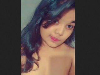 A stunning young woman reveals her attractive physique