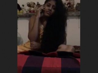 Solitary woman masturbates while talking on the phone
