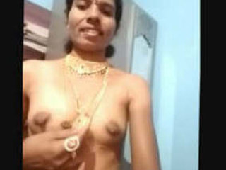 Auntie in traditional jewelry bares her breasts and pussy on camera