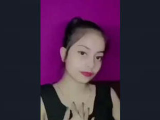 A sweet Indian girl flaunts her big breasts in a seductive performance