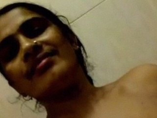 Mature Indian woman captures her nude body in the bathroom