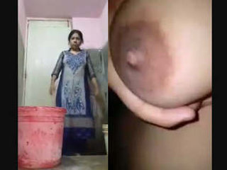 Bhabhi's solo bathroom session with her breasts on full display