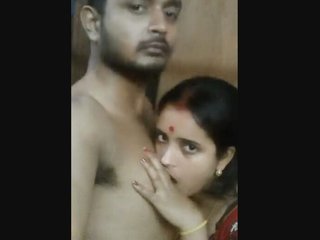Married couple's intimate moments in a village setting