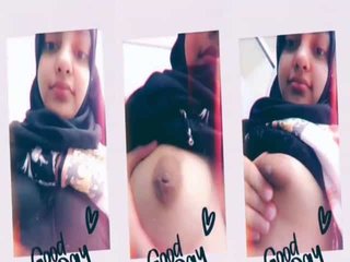 A cute hijabi girl reveals her ample bosom on camera