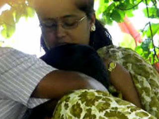 Caught by surprise: Couple enjoys some private time in the park