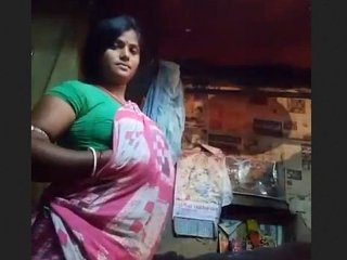 Busty beauty Boudi flaunts her ample bosom in a village setting