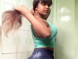 Busty Indian babe flaunts her curves in a revealing outfit