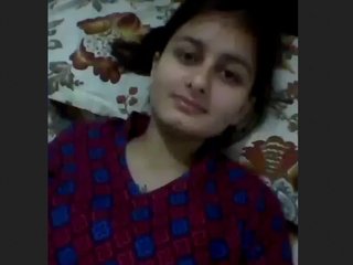 Horny brunette masturbates with her fingers and boobs