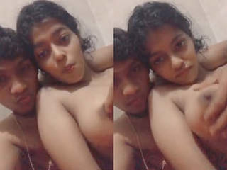 Indian guy has fun with a girl's small boobs on camera