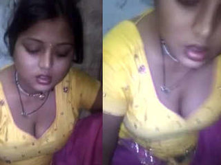 A sweet girl enjoys a chapathi while showcasing her milky cleavage
