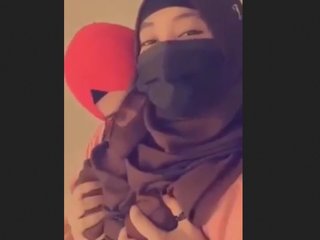 Hijab-wearing lesbians have a passionate encounter in this steamy video