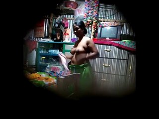 Desi bhabhi's ample bosom caught on camera by perverted neighbor